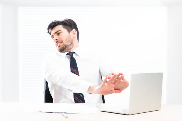 istock Stressed  businessman on computer desk in office 1291837679
