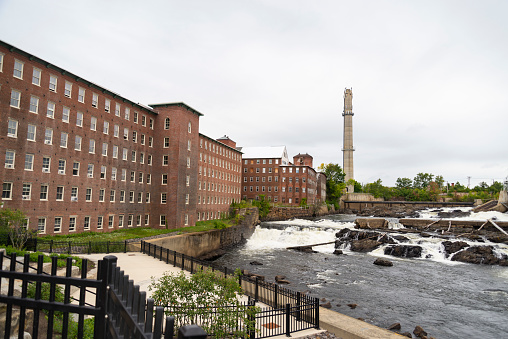 The historic brick Pepperell center or former mill building in the town of Biddeford Maine on the Saco River.