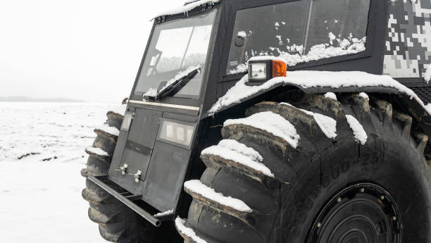 istock All-terrain vehicles on a winter background. Powerful off-road transporter. Engine, cross. Adventure concept. 1291841013