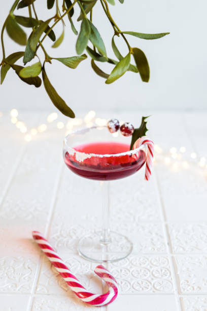 istock Festive Cranberry Cocktail for Christmas with mistletoe 1291841974