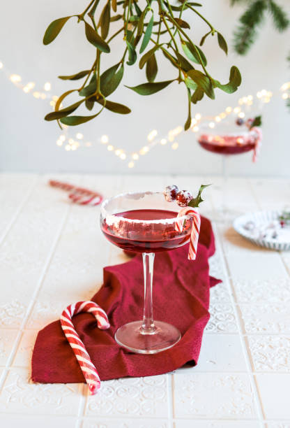 istock Festive Cranberry Cocktail for Christmas with mistletoe 1291842037