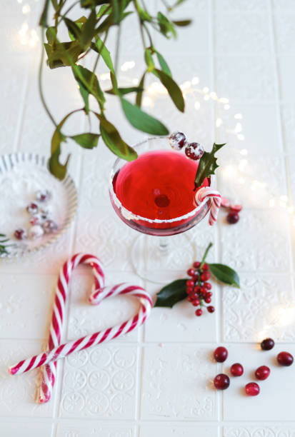 istock Festive Cranberry Cocktail for Christmas with mistletoe 1291842118