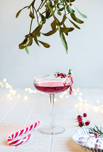 Festive Cranberry Cocktail for Christmas with mistletoe