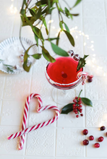istock Festive Cranberry Cocktail for Christmas with mistletoe 1291842130