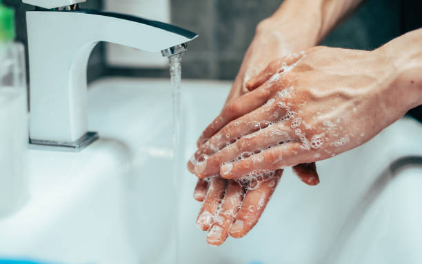 istock close up. modern guy carefully lathering his hands 1291842242