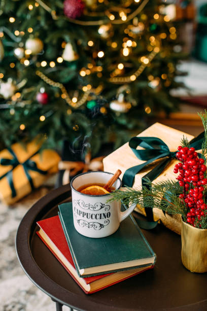 istock christmas decor cup tea bokeh garlands sofa 1291846445
