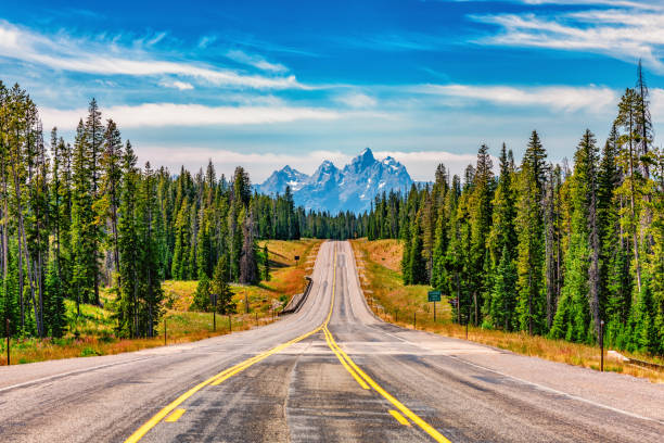 road into the tetons - teton range grand teton national park mountain rural scene imagens e fotografias de stock