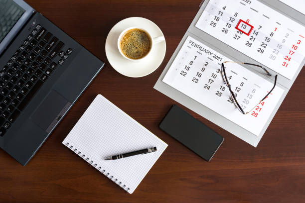 istock Top view of wooden office desk table 1291850888
