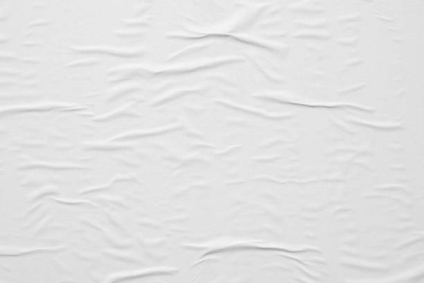 istock Blank white crumpled and creased paper poster texture background 1291852664