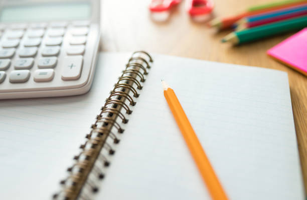 istock Blank notebook and office or school supplies 1291852762