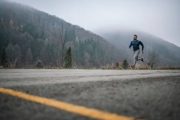 istock Male Athlete Practicing Sprints Outdoor. 1291853060