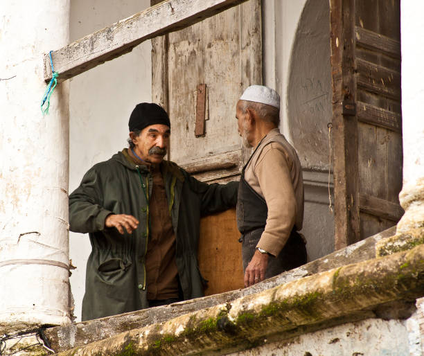 Rabat, Morocco: Two men chatting on a balcony in the Rabat Medina.