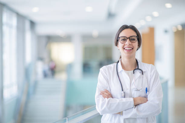 istock Smiling Hispanic female doctor in lab coat 1291853855
