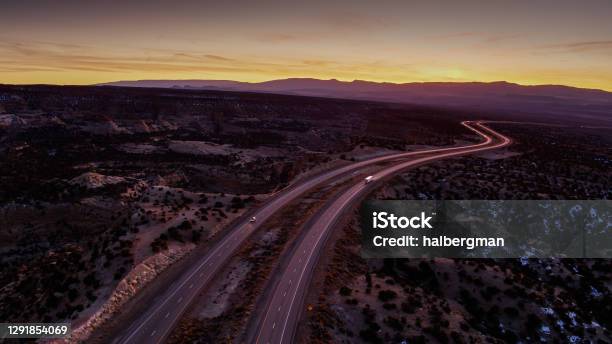 Truck And Car On I70 In San Rafael Swell After Sunset Aerial Stock Photo - Download Image Now