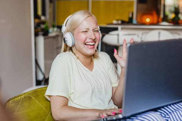 istock Young woman is communicating via video call at home 1291854103