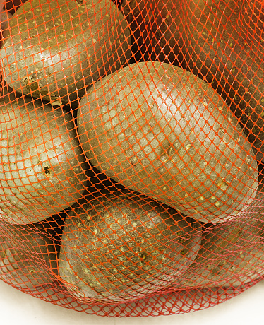 grocery pack of fresh potato, closeup