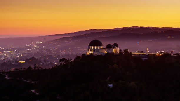 Griffith Observatory Silhouette and Hollywood Hills at Sunset Aerial shot of Los Angeles from over Griffith Park at sunset. griffith park observatory stock pictures, royalty-free photos & images
