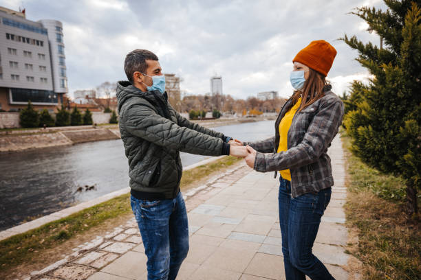 istock Couple spinning in the city 1291857536
