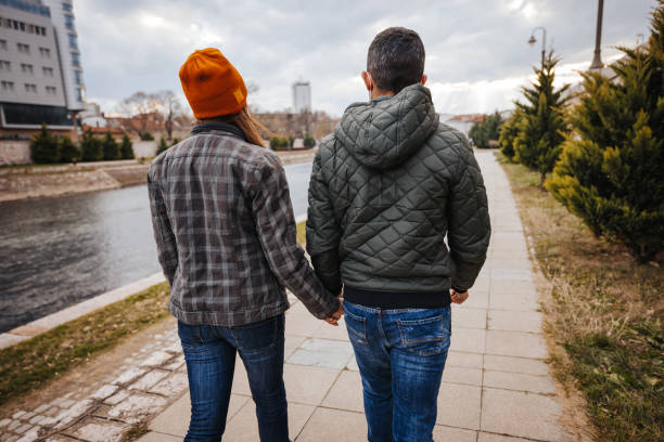 istock Young couple walking on city quay 1291857585