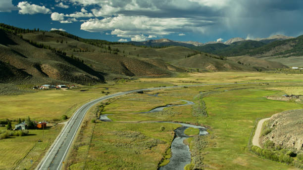 istock Empty Highway in Meadow in Rocky Mountains 1291858166