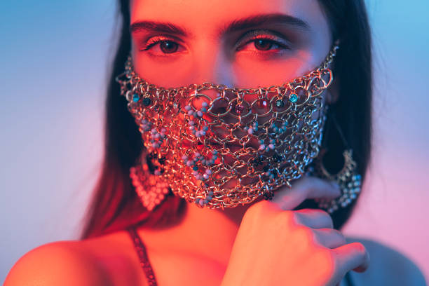 istock carnival accessory neon light portrait woman mask 1291859132