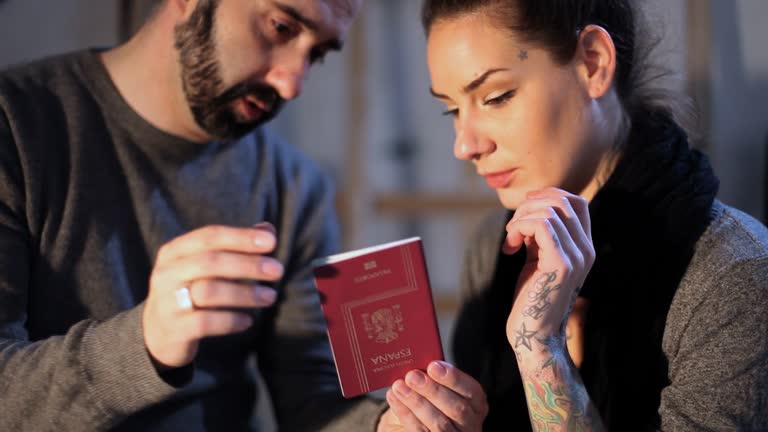 Art forger and artist looking at forged documents, close-up