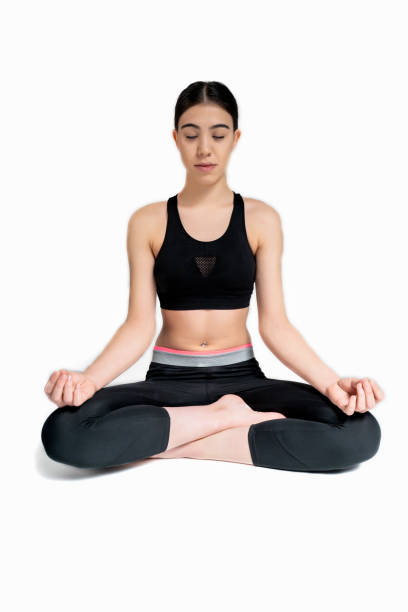 istock Young woman doing yoga practice isolated on white background. 1291866021