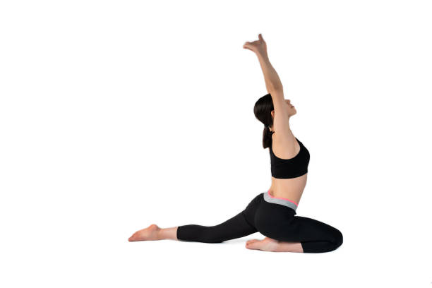 istock Young woman doing yoga practice isolated on white background. 1291866031