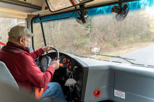 istock Senior man, the driver, driving a truck. 1291873627