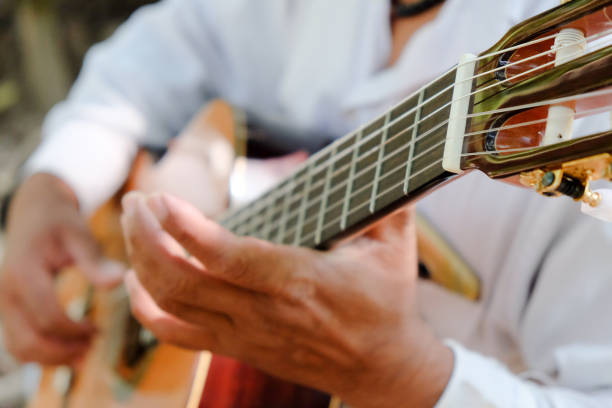 istock Man playing an acoustic guitar 1291873793