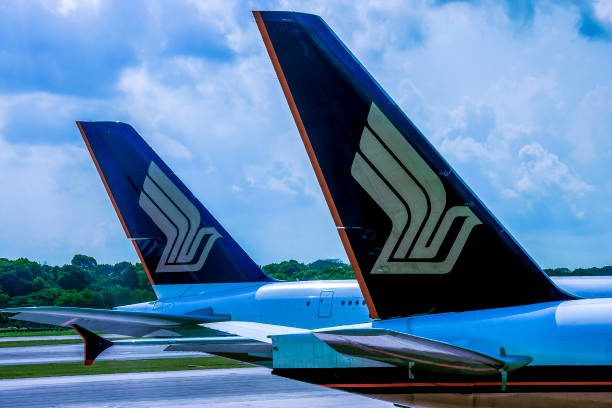 Singapore Aug 13 2019:   The tails of an Singapore Airlines Airbus 340 at the  apron on Changi International airport.