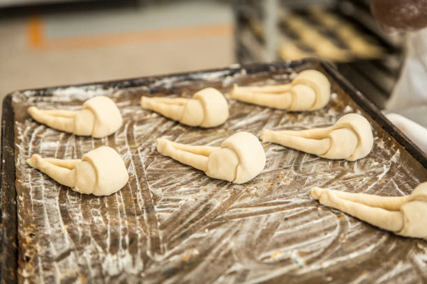 istock hands of the baker kneading the dough 1291875746