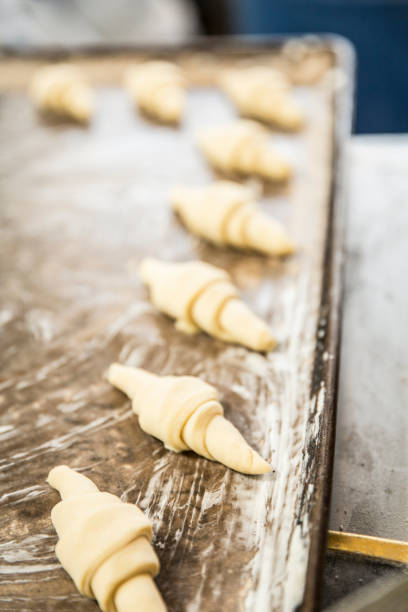 istock hands of the baker kneading the dough 1291875887