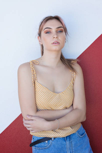 istock Young Woman On Red/White Wall 1291881207