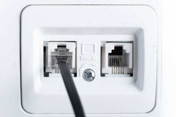 istock telephone socket and telephone cable on the wall 1291887786