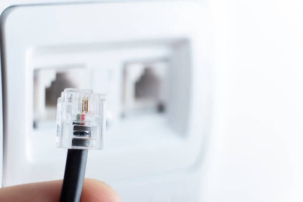 istock telephone socket and telephone cable on the wall 1291887850