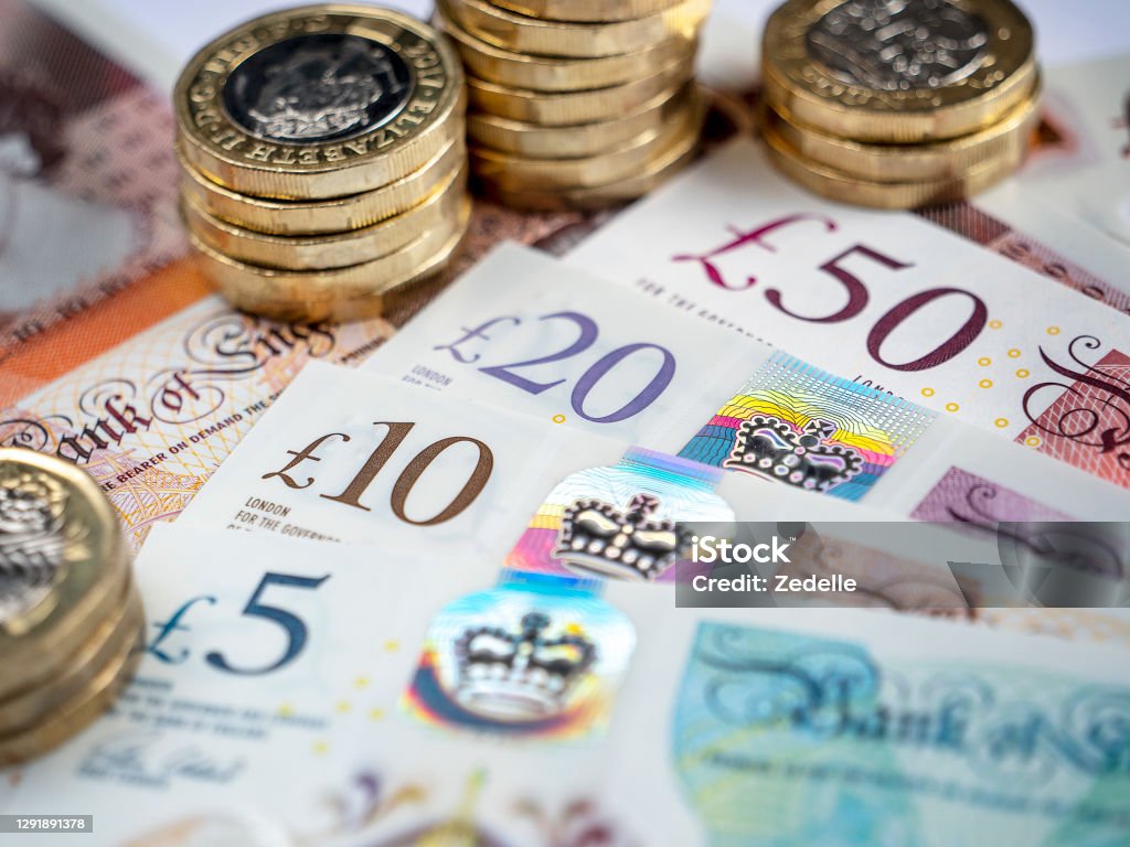 British Pound Notes and Coins Close-up of British bank notes British Currency Stock Photo
