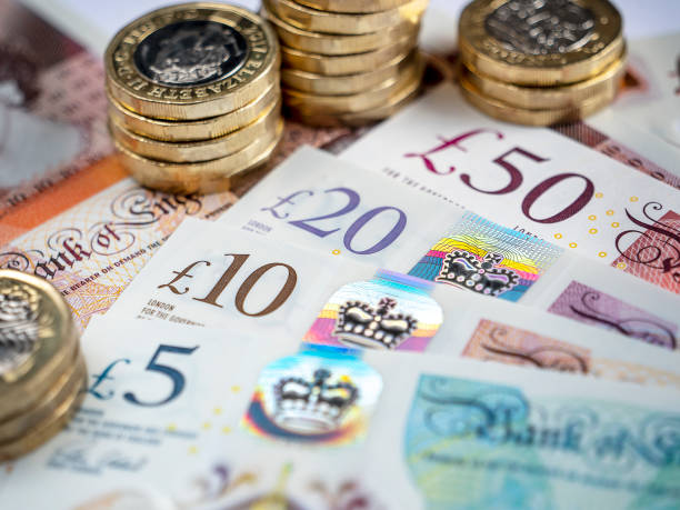 British Pound Notes and Coins Close-up of British bank notes bank of england stock pictures, royalty-free photos & images