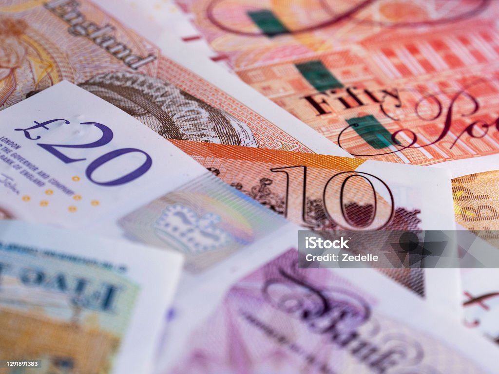 British Pound Notes and Coins Close-up of British bank notes British Currency Stock Photo