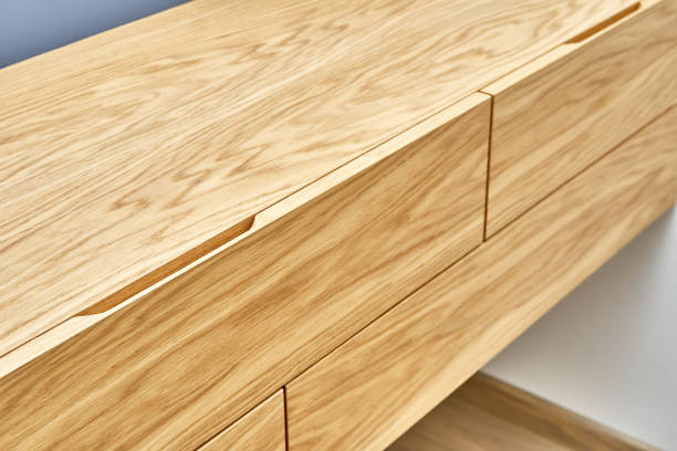 istock Floating wooden cabinet of finger pull design closeup 1291892721