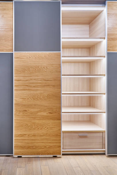 istock Wardrobe with LED lighting, sliding doors and inner case of light laminated particle boards 1291893652