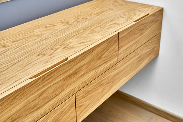 istock Floating wooden cabinet of finger pull design closeup 1291894637