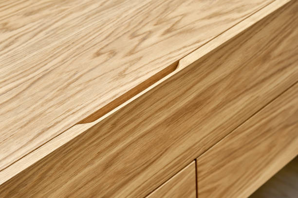istock Floating wooden cabinet of finger pull design closeup 1291894657