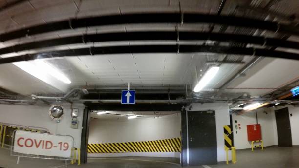 istock Driving to Covid-19 Coronavirus Testing Station on Underground Parking Dash Cam 1291897087