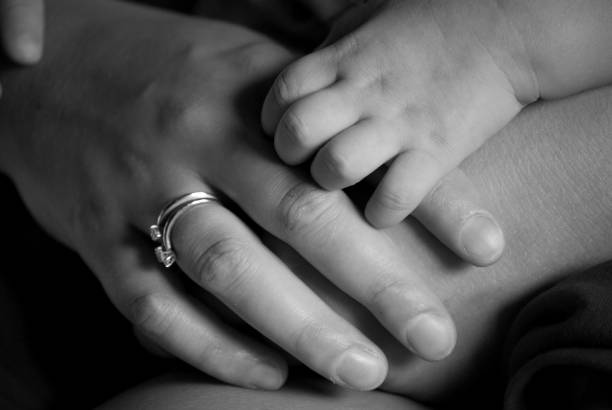 mother and son hands stock photo