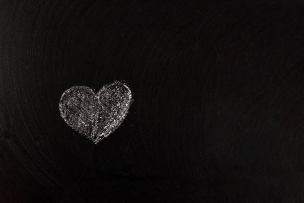 istock heart drawn on a chalkboard, a symbol of love 1291902377