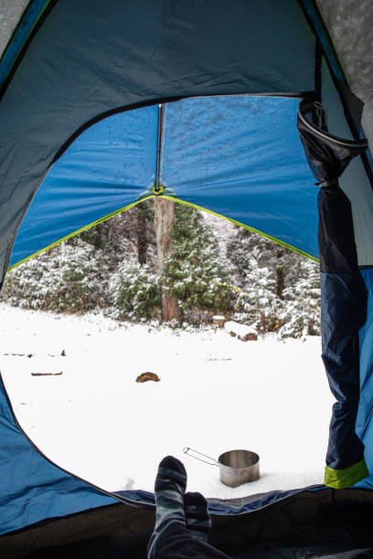istock POV view looking out from inside tent to snow 1291902398