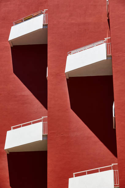 istock Geometric red building facade. Architectural minimalism design. Urban perspective 1291902800