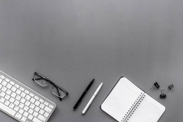 istock Office workplace flat lay background. Keyboard and office supplies top view 1291903468