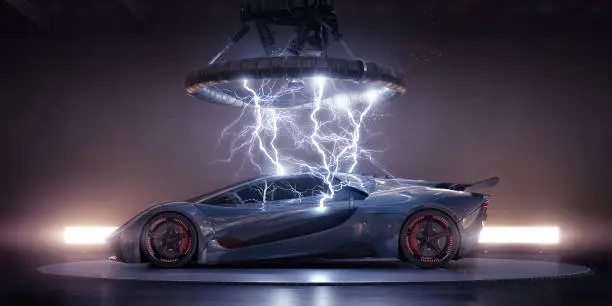 Side view of a generic blue-grey sports car with orange highlights parked on a turntable in an industrial building under a large  coil, from which multiple strikes of electrical lightning are emanating, striking the bodywork of the vehicle. The has lights behind it, and a thin haze.